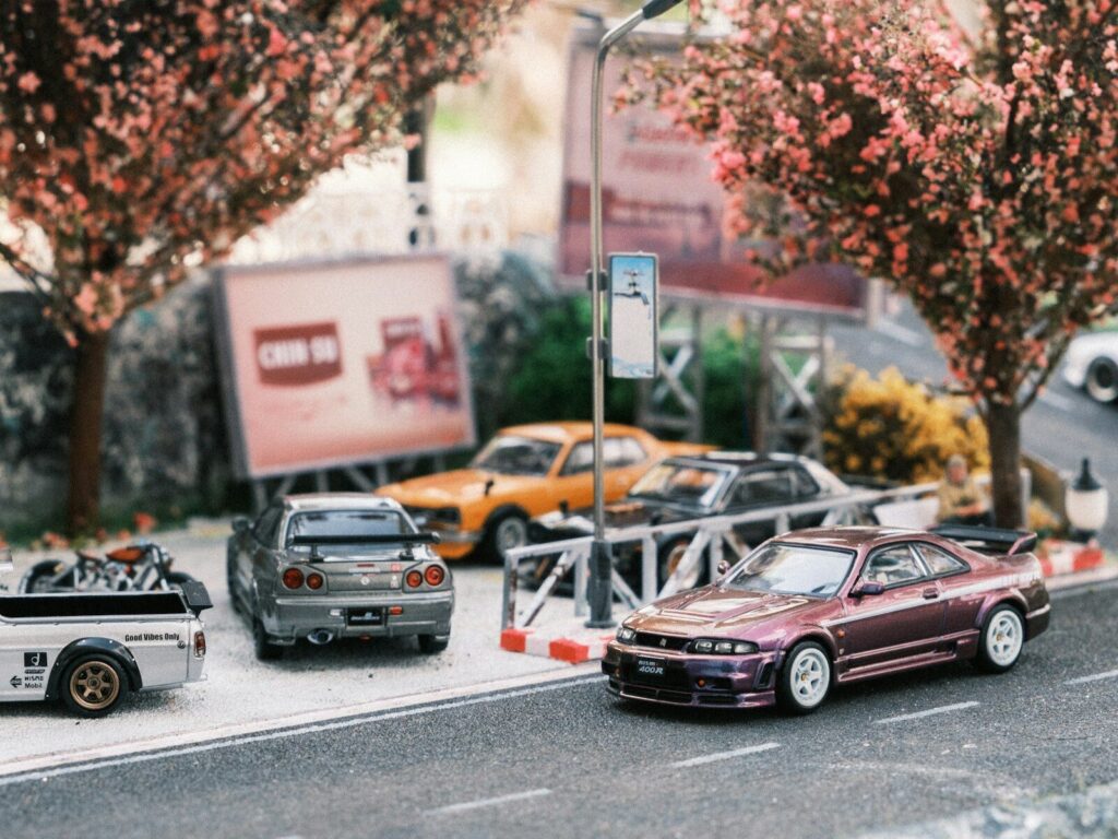 A group of cars parked on the side of a road