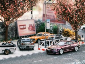 A group of cars parked on the side of a road